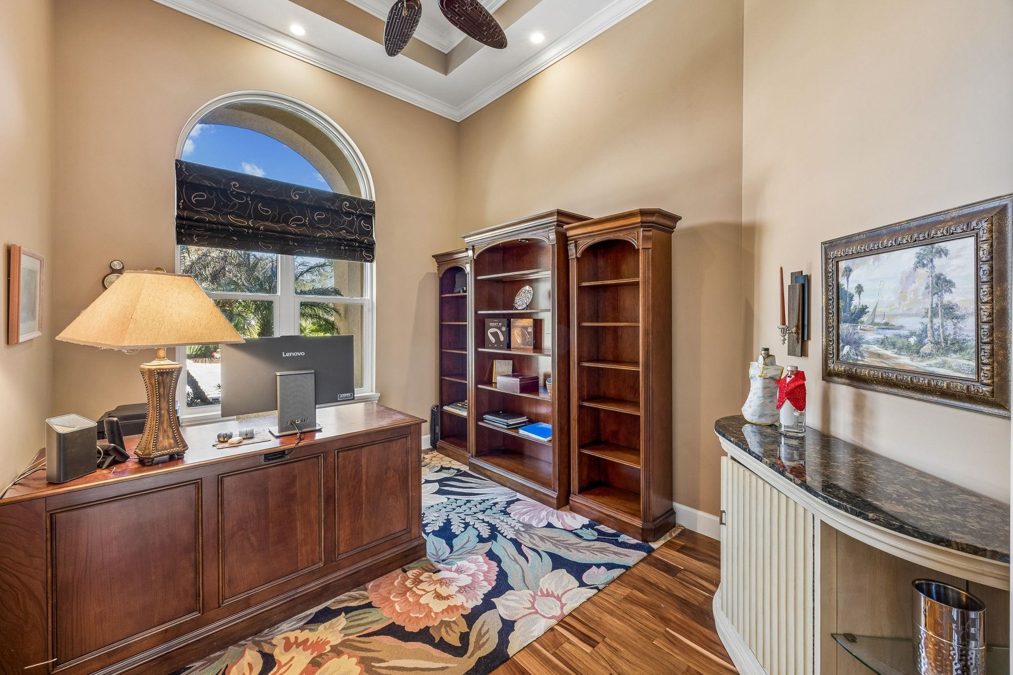 409 Lookout Point Drive St. Augustine, FL 32080 - Photo 43 of 90 Office featuring ornamental molding, dark wood finished floors, a high ceiling, and ceiling fan