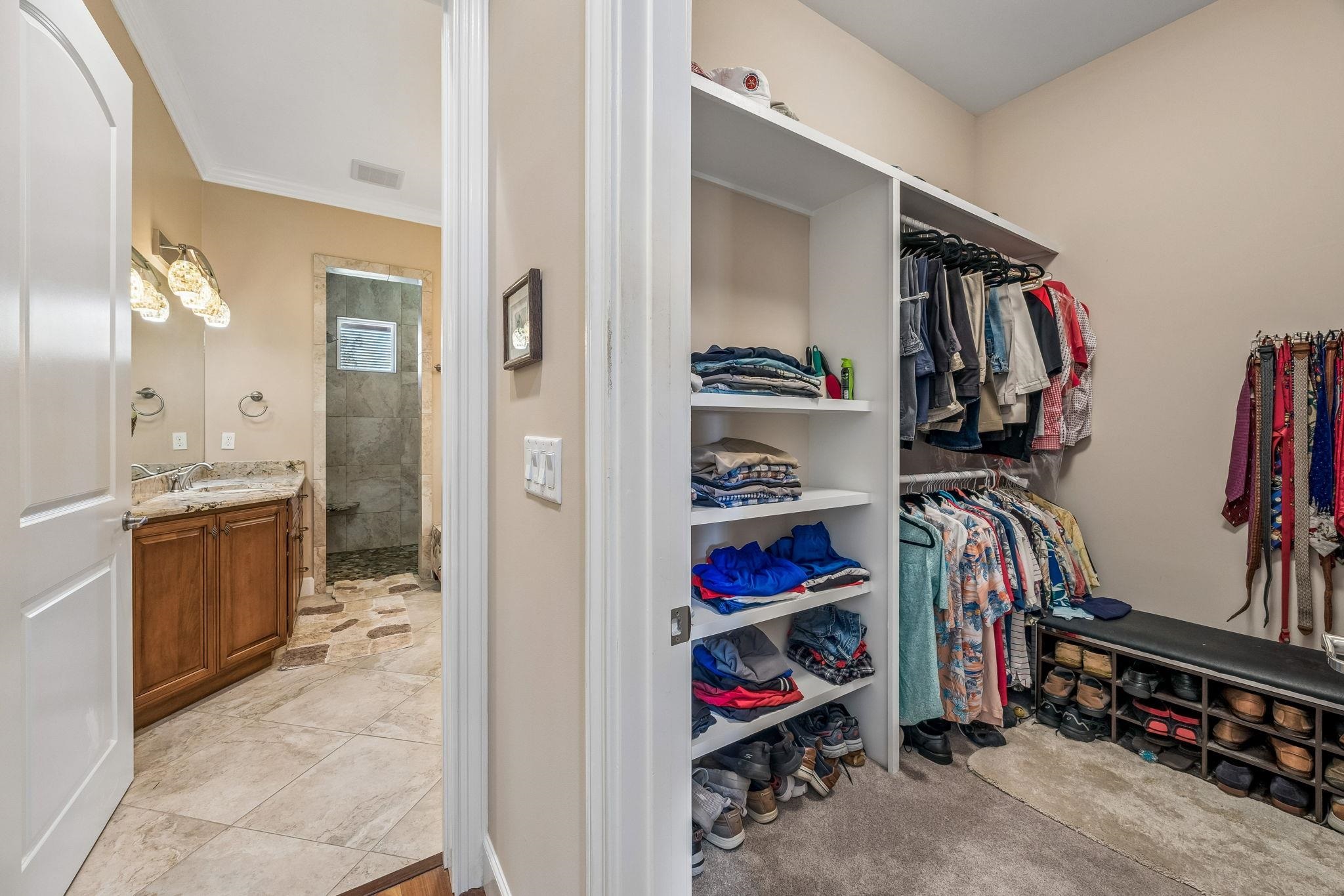 409 Lookout Point Drive St. Augustine, FL 32080 - Photo 50 of 90 a view of walk in closet with clothes and shoes