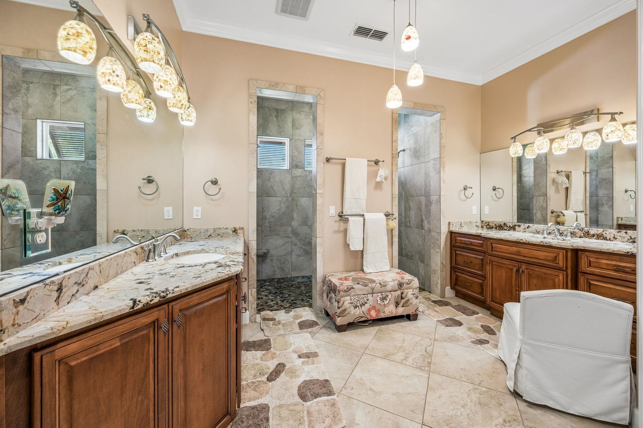 409 Lookout Point Drive St. Augustine, FL 32080 - Photo 51 of 90 Bathroom featuring two vanities, ornamental molding, and a walk in shower