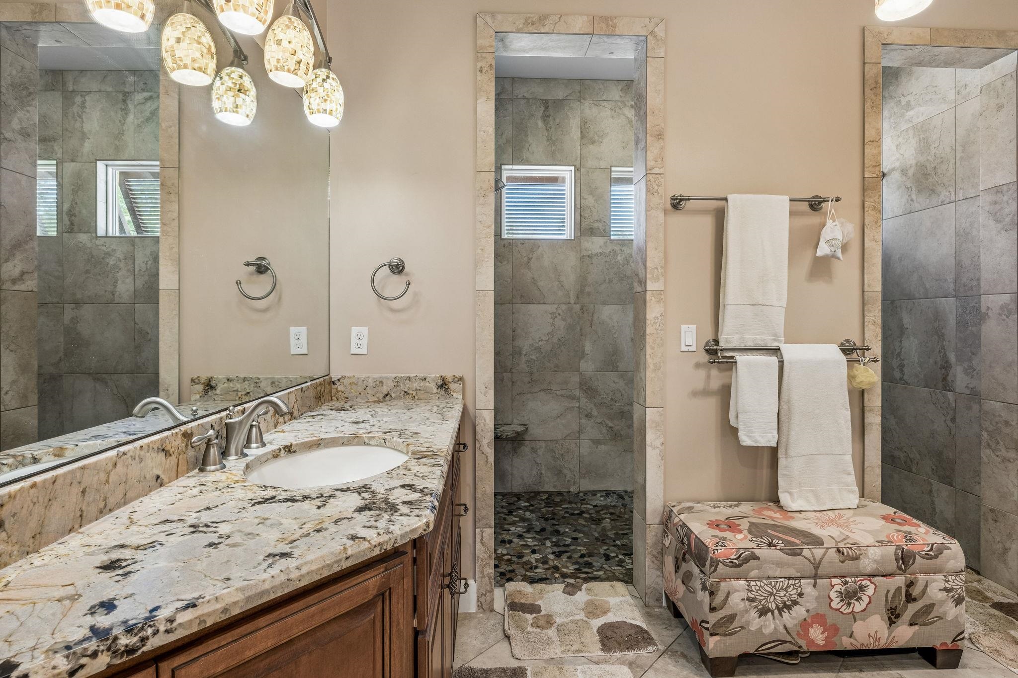 409 Lookout Point Drive St. Augustine, FL 32080 - Photo 52 of 90 a bathroom with a granite countertop sink a toilet and shower