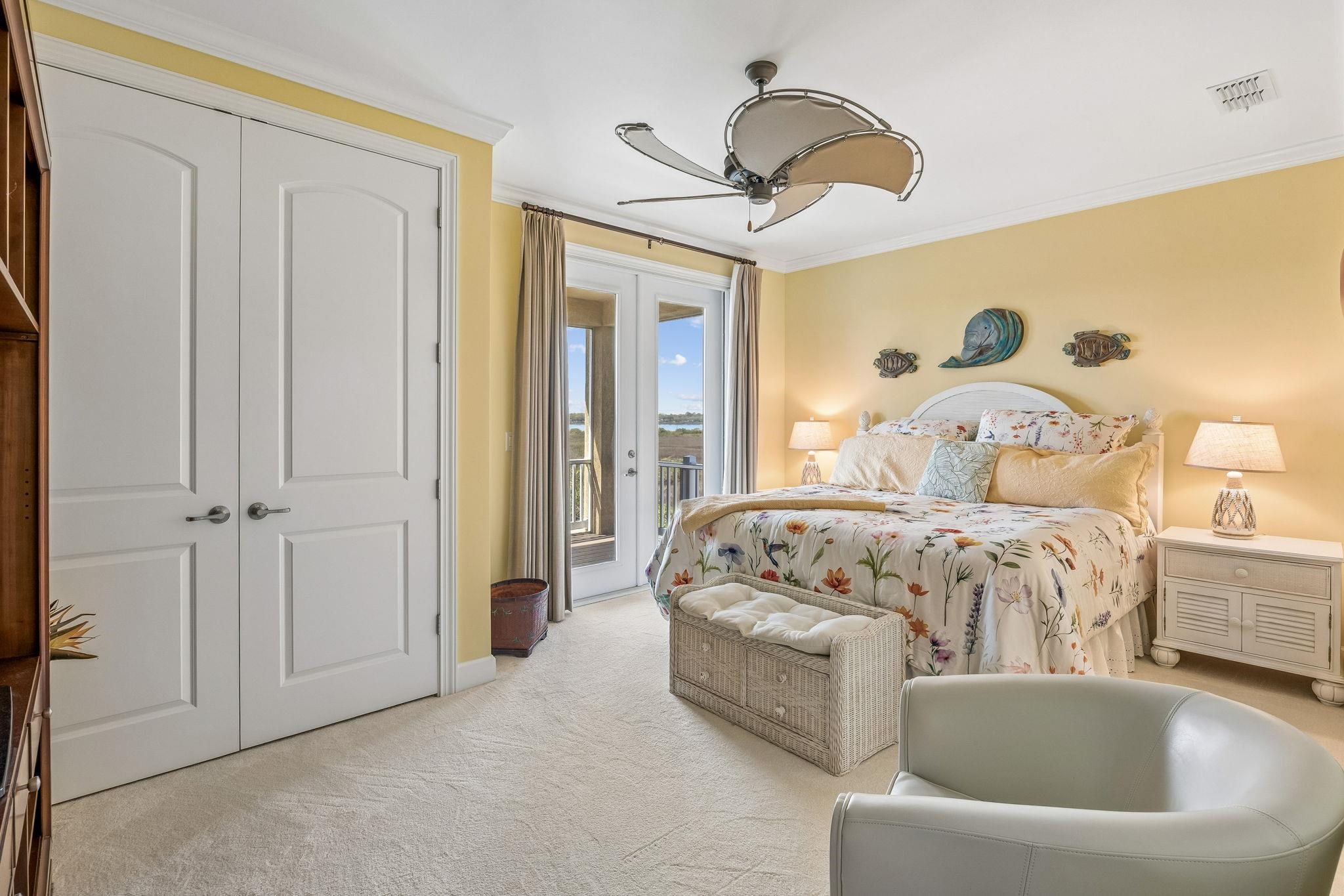 409 Lookout Point Drive St. Augustine, FL 32080 - Photo 61 of 90 a bedroom with a bed and a chandelier