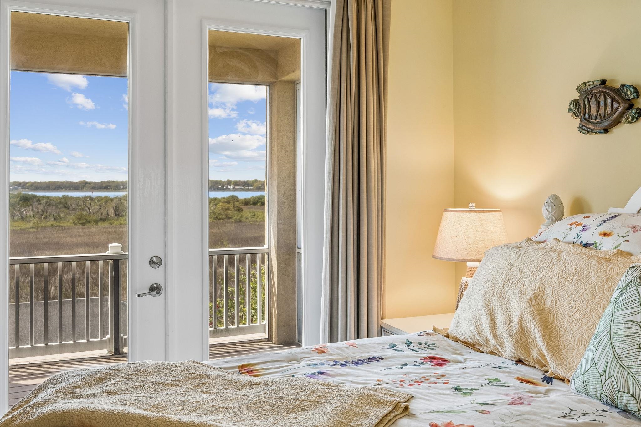 409 Lookout Point Drive St. Augustine, FL 32080 - Photo 63 of 90 Bedroom with access to exterior, a water view, and multiple windows