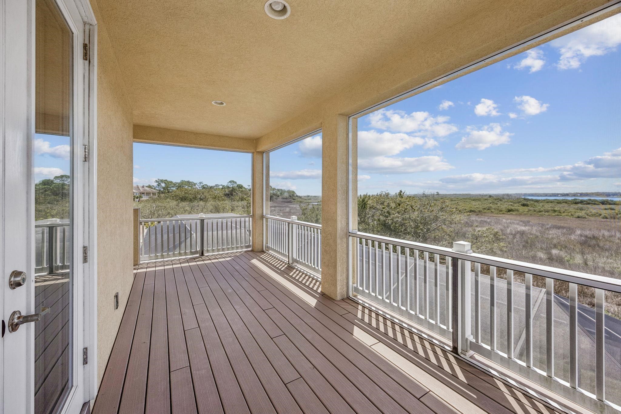 409 Lookout Point Drive St. Augustine, FL 32080 - Photo 66 of 90 a view of a balcony with wooden floor