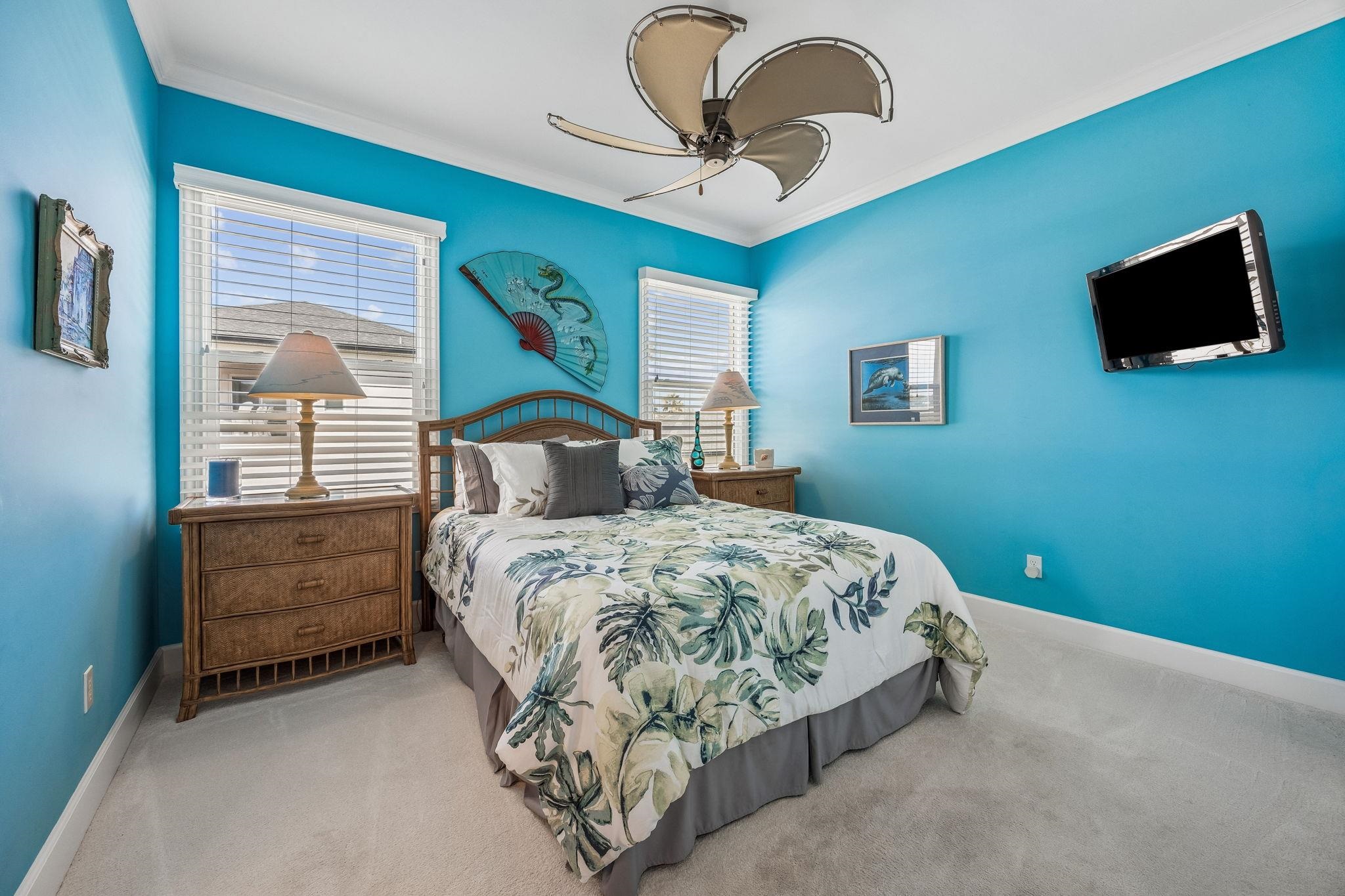 409 Lookout Point Drive St. Augustine, FL 32080 - Photo 68 of 90 a bedroom with a bed and a flat screen tv