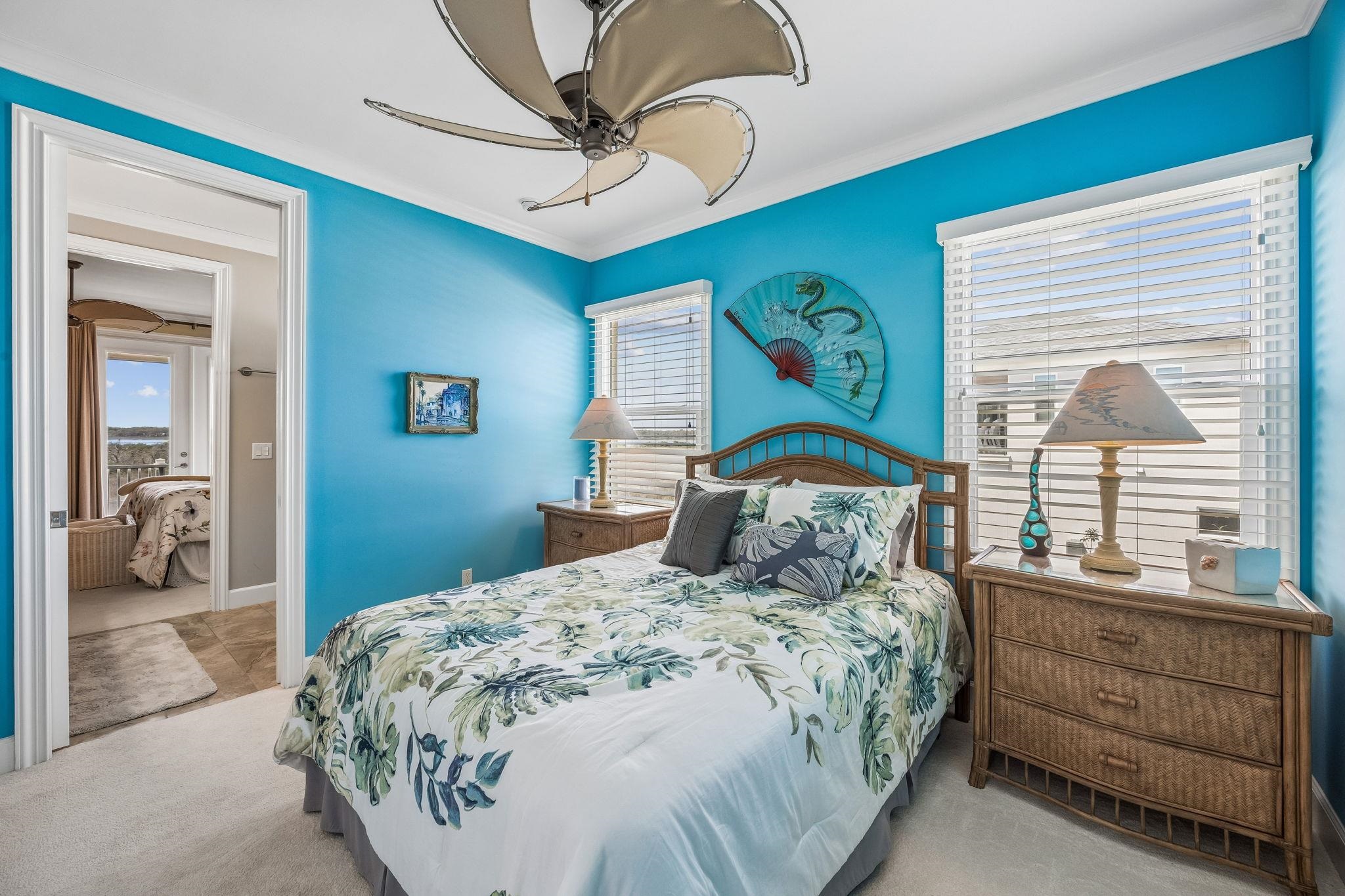 409 Lookout Point Drive St. Augustine, FL 32080 - Photo 70 of 90 a bedroom with a large bed and a window