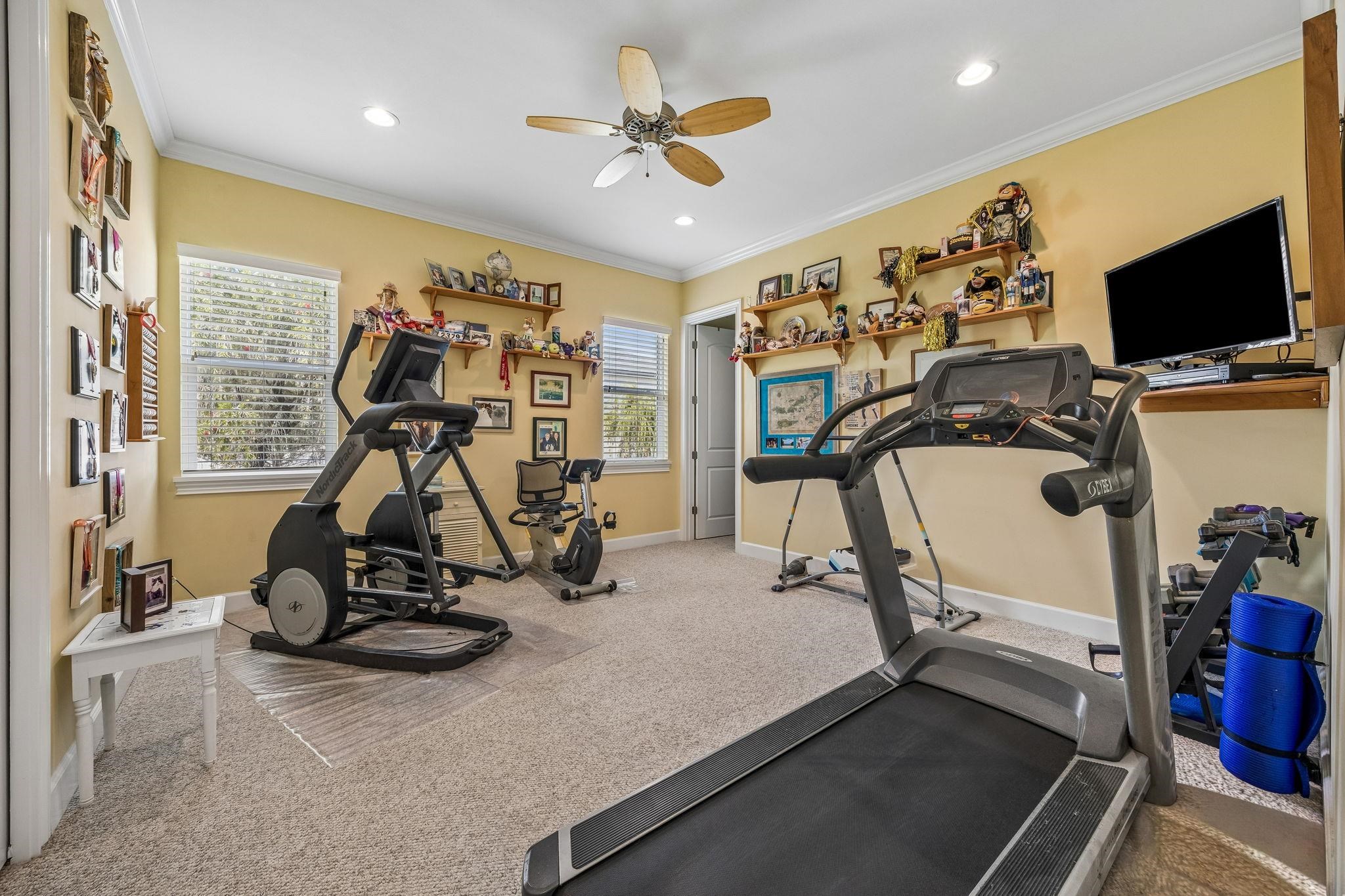 409 Lookout Point Drive St. Augustine, FL 32080 - Photo 73 of 90 Workout room featuring ceiling fan, crown molding, recessed lighting, and carpet floors