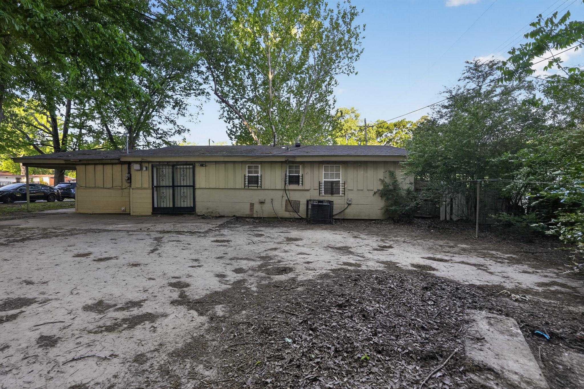 4504 Neely Road Memphis, TN 38109 - Photo 5 of 32 a view of a house with a backyard