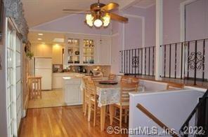 11 Shawnee Road Trumbull, CT 06611 - Photo 6 of 14 a view of a dining room with furniture a chandelier and wooden floor