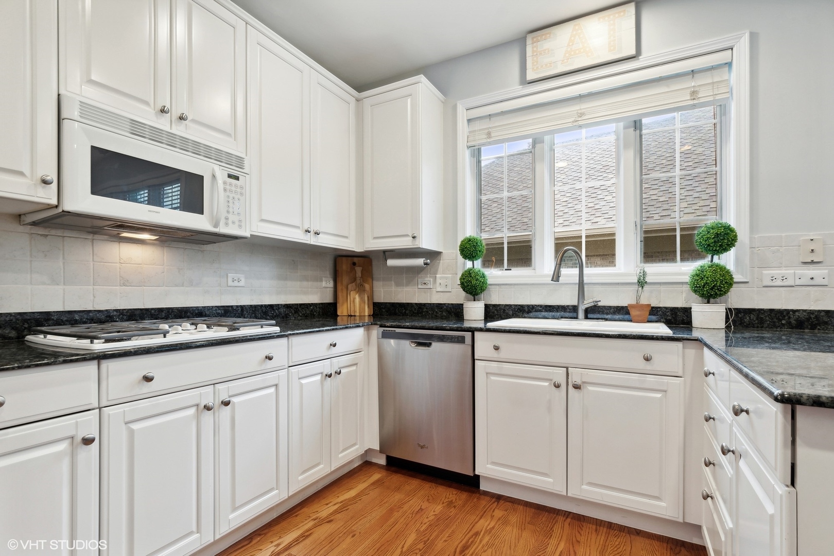 2013 Royal Ridge Drive Northbrook, IL 60062 - Photo 11 of 43 a kitchen with granite countertop white cabinets and white stainless steel appliances