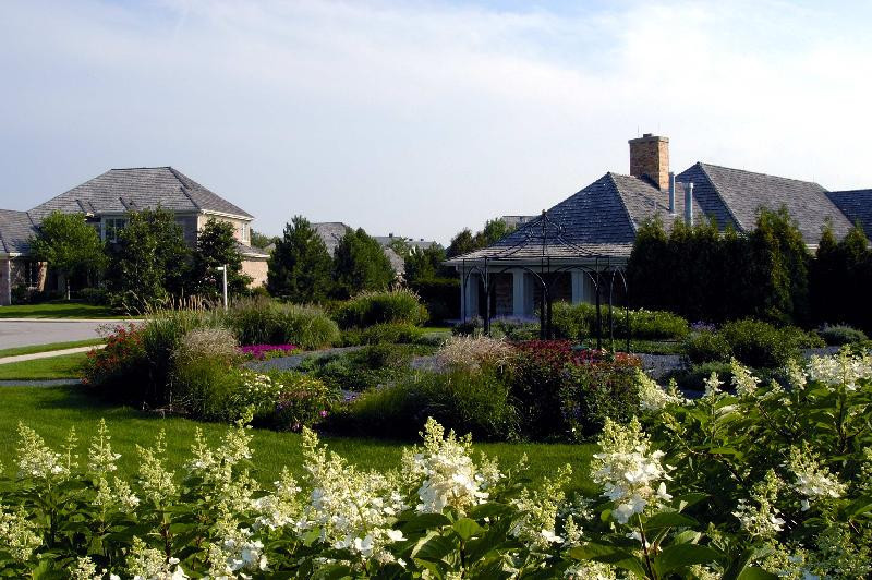2013 Royal Ridge Drive Northbrook, IL 60062 - Photo 29 of 43 a front view of house with a yard and potted plants