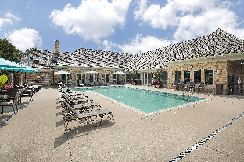 2013 Royal Ridge Drive Northbrook, IL 60062 - Photo 32 of 43 a view of a house with swimming pool and sitting area