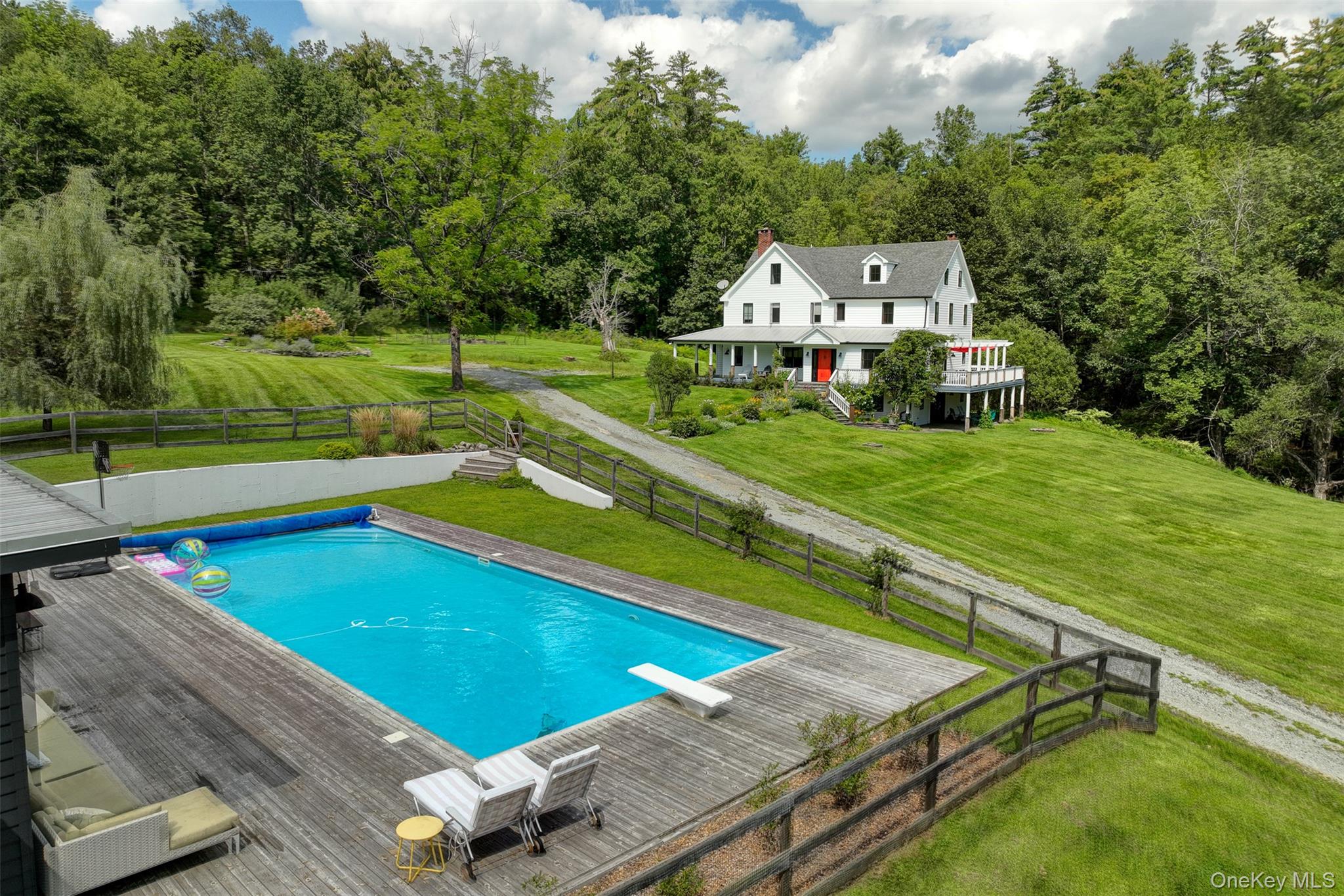 an aerial view of a house with swimming pool