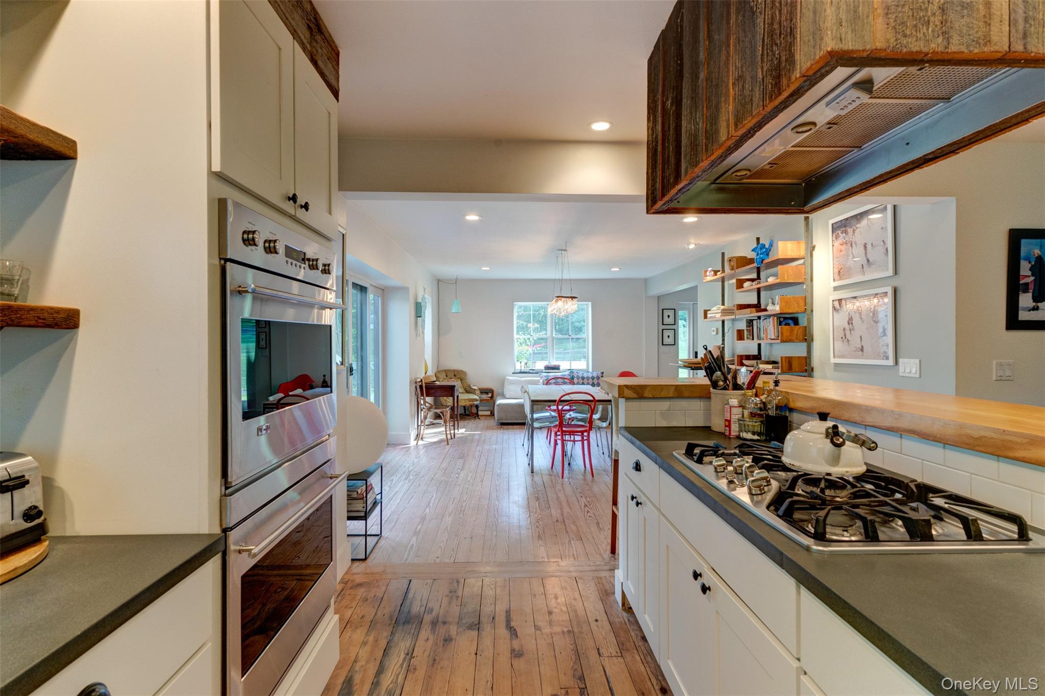 39 Deep Hollow Hill Road Narrowsburg, NY 12764 - Photo 11 of 47 a kitchen with lots of counter top space a stove and wooden floor