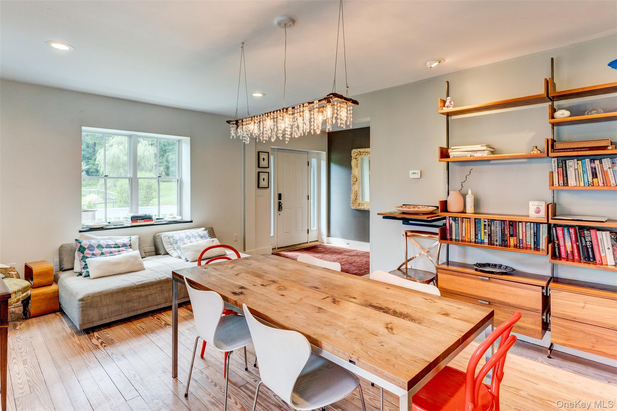 39 Deep Hollow Hill Road Narrowsburg, NY 12764 - Photo 13 of 47 a dining room with furniture and a book shelf