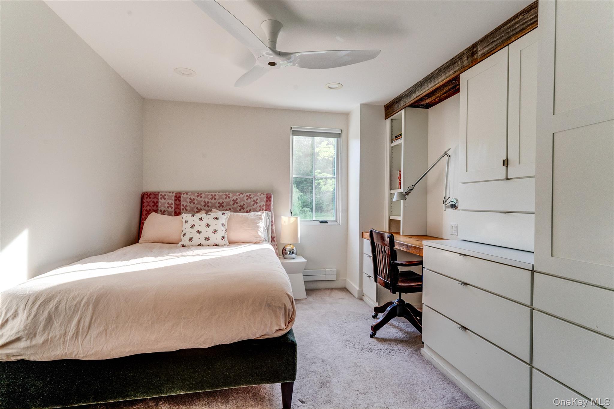 39 Deep Hollow Hill Road Narrowsburg, NY 12764 - Photo 26 of 47 a bedroom with a bed and a chandelier