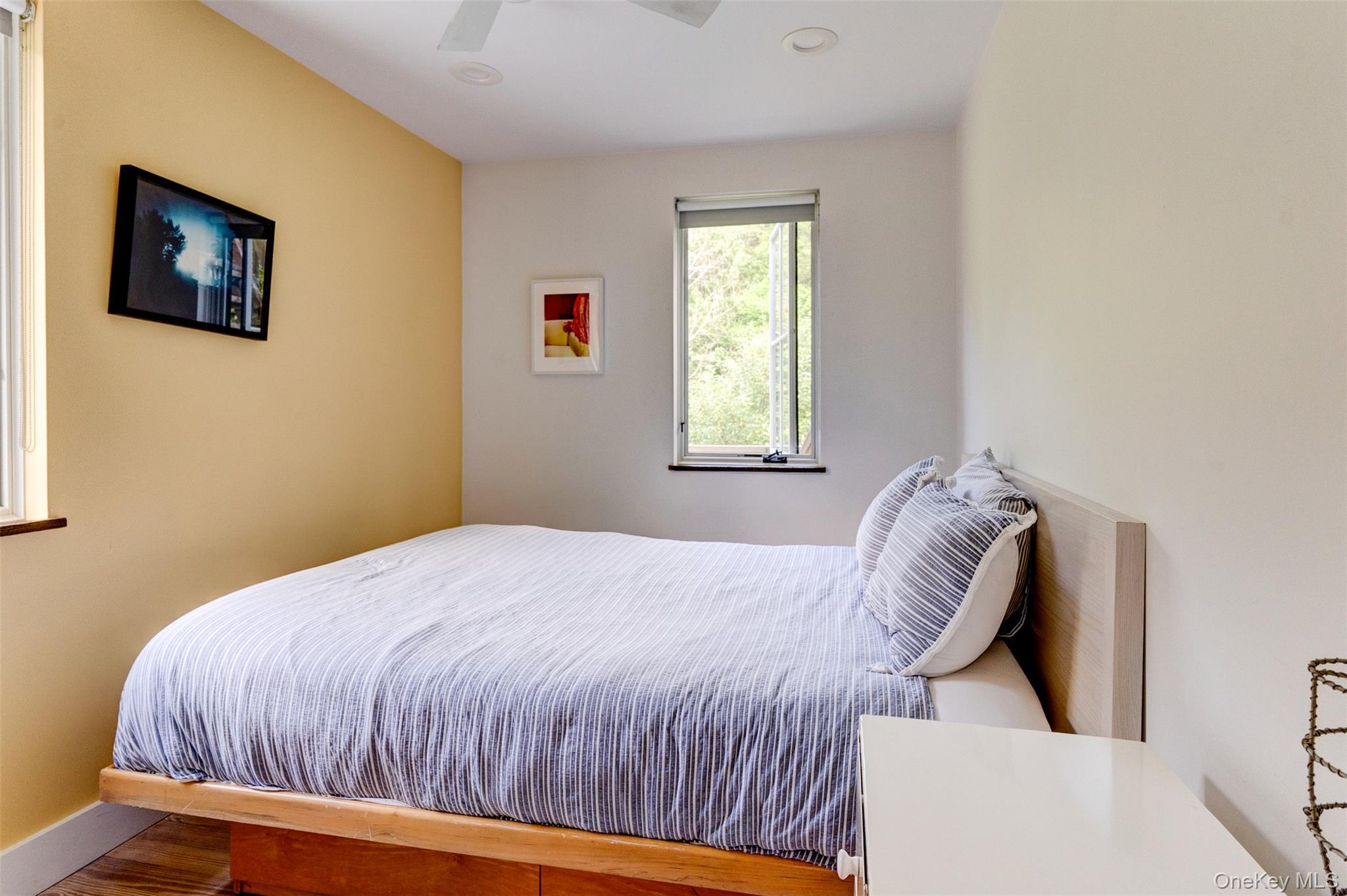 39 Deep Hollow Hill Road Narrowsburg, NY 12764 - Photo 27 of 47 a bed sitting in a bedroom next to a window
