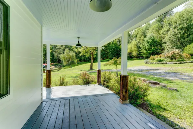 a view of porch with wooden floor
