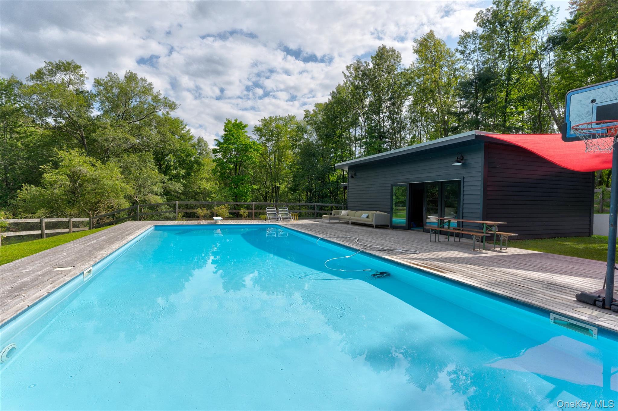 39 Deep Hollow Hill Road Narrowsburg, NY 12764 - Photo 38 of 47 a view of a house with swimming pool and sitting area