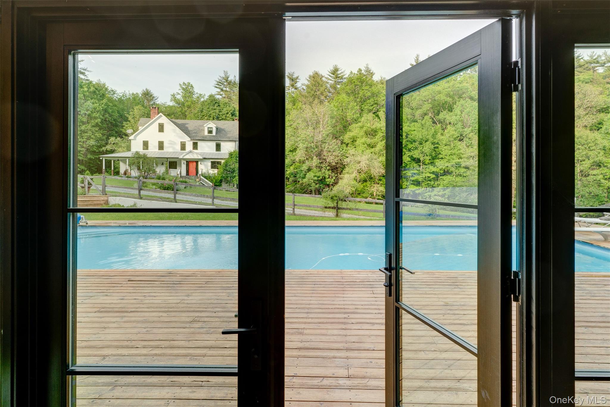 39 Deep Hollow Hill Road Narrowsburg, NY 12764 - Photo 40 of 47 a view of a glass door with a from a window