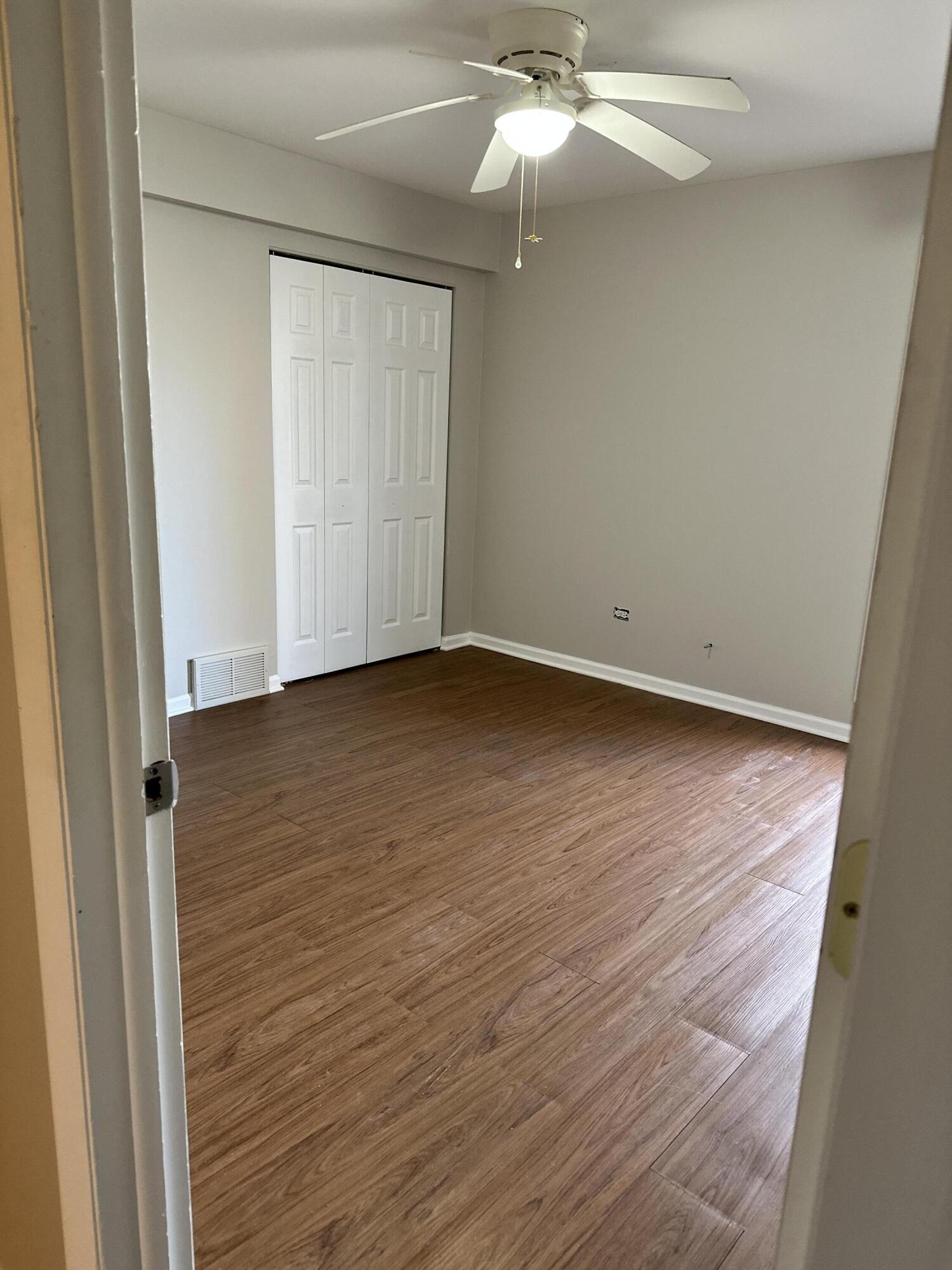 405 Old Stone Road, Unit E2 Munster, IN 46321 - Photo 16 of 20 a view of an empty room with wooden floor