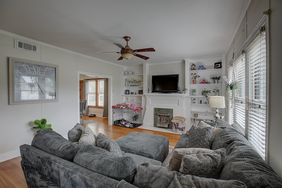 1708 Olive Street Georgetown, TX 78626 - Photo 2 of 38 Gorgeous oak flooring in excellent condition. Built in bookcases, and decorative fireplace. Tall ceilings and recent paint make this historic home move in ready.