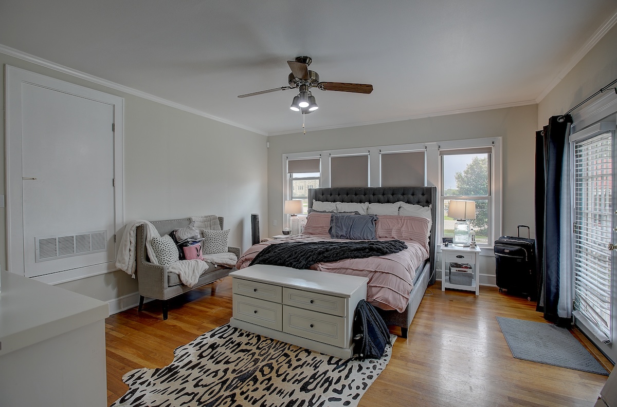 1708 Olive Street Georgetown, TX 78626 - Photo 6 of 38 This room is multi purpose. Often used as primary bedroom, it's large with great light. also used as office/family space. The allure of older homes is the multiple purposes.