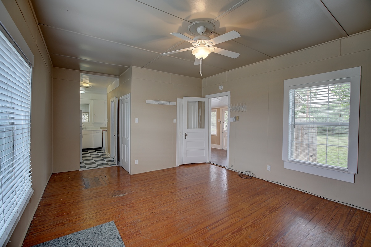 1708 Olive Street Georgetown, TX 78626 - Photo 8 of 38 Long leaf pine flooring in Guest bedroom. Guest house has washer/dryer/fridge/stove.