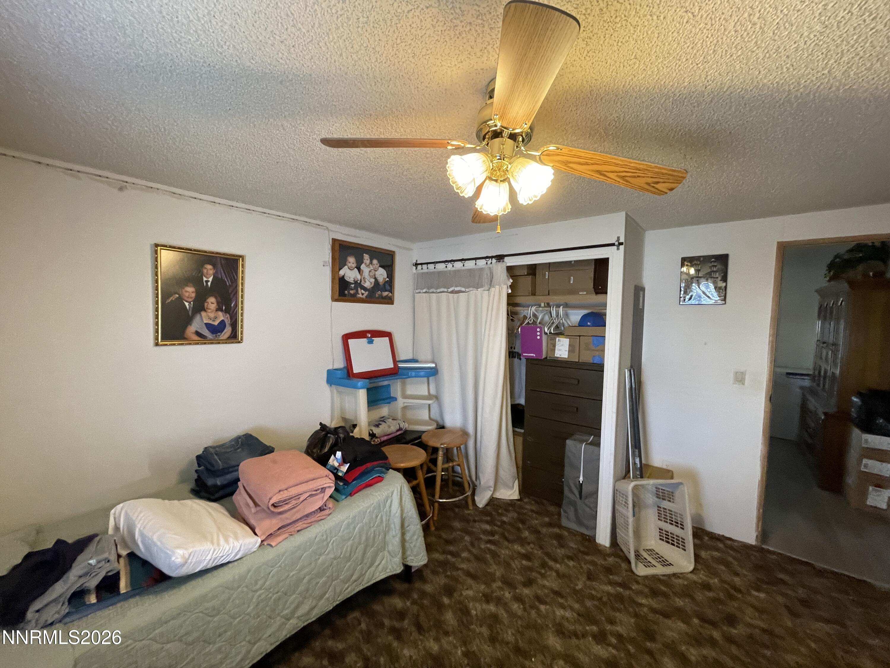 795 16th Street Lovelock, NV 89419 - Photo 14 of 28 a living room with furniture and a flat screen tv