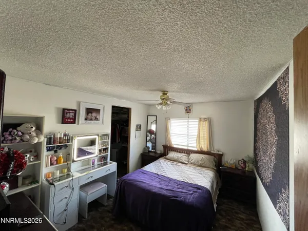 a bed room with a bed and a window