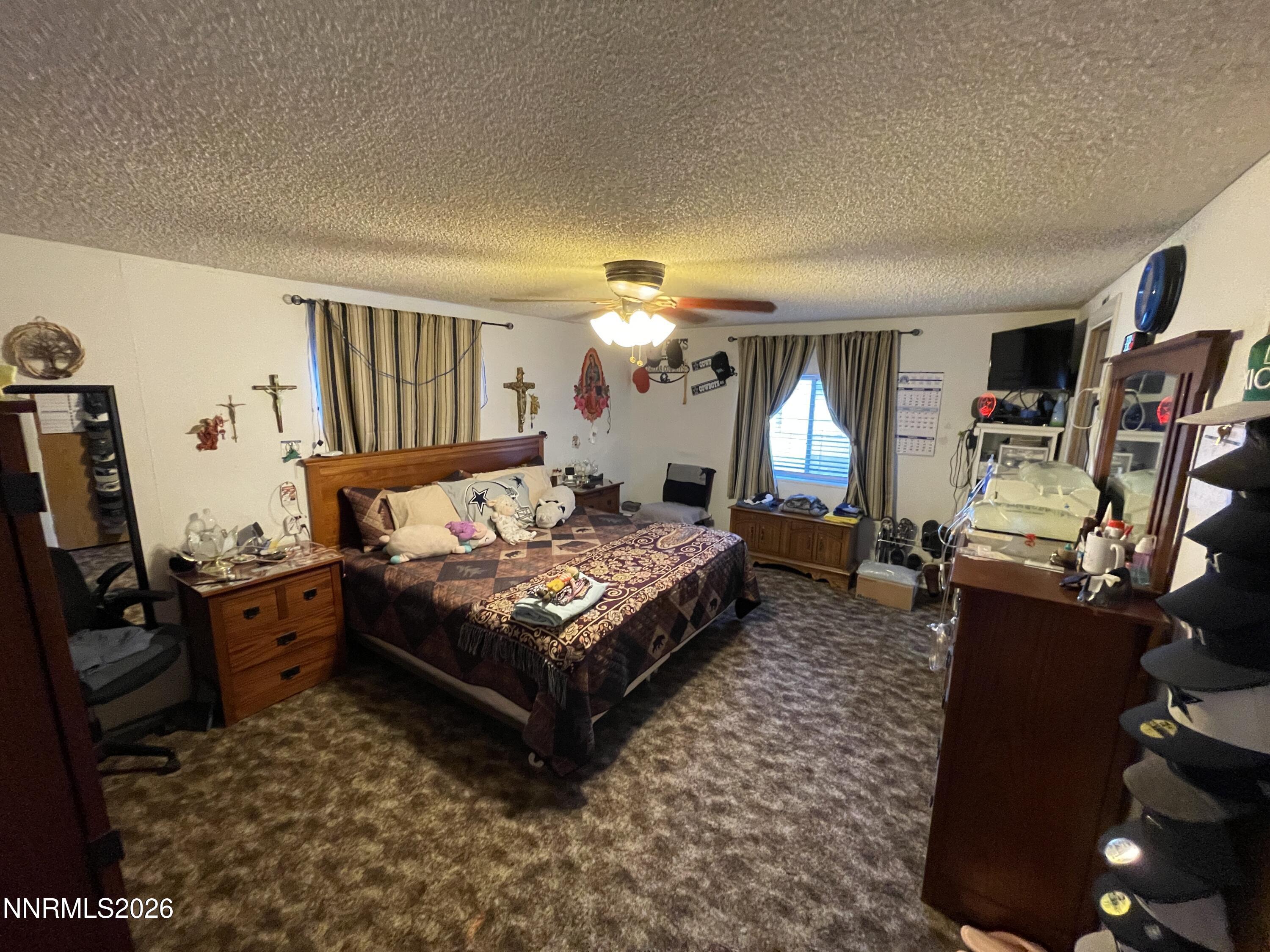 795 16th Street Lovelock, NV 89419 - Photo 18 of 28 a living room with furniture a flat screen tv and a window
