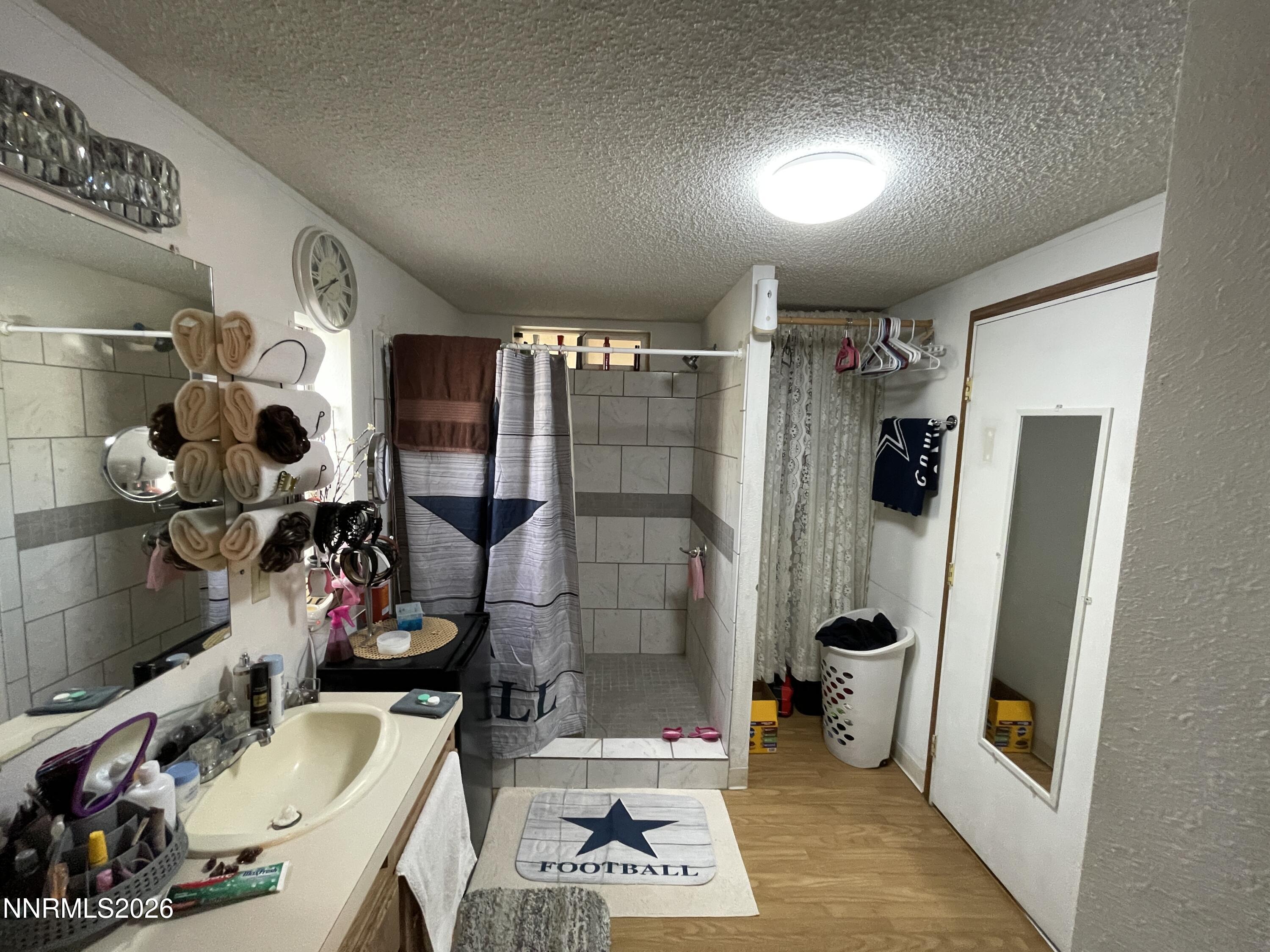 795 16th Street Lovelock, NV 89419 - Photo 21 of 28 a bathroom with a sink toilet and shower