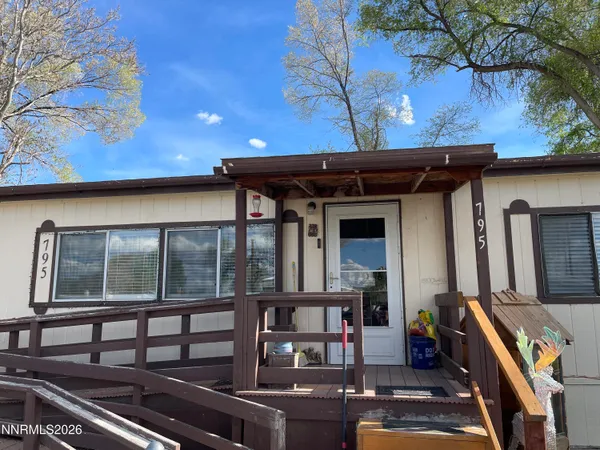 front view of a house with a large window