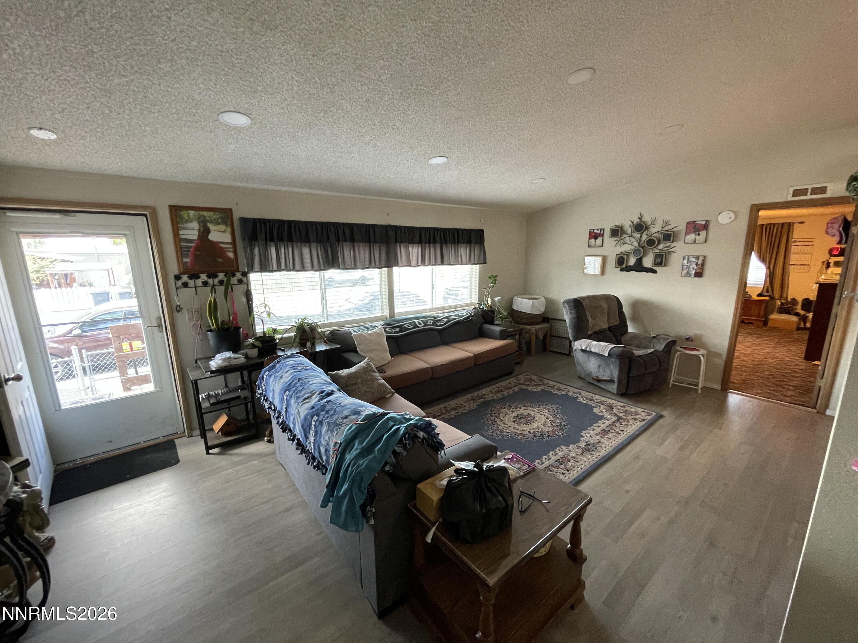 795 16th Street Lovelock, NV 89419 - Photo 5 of 28 a living room with furniture and a flat screen tv