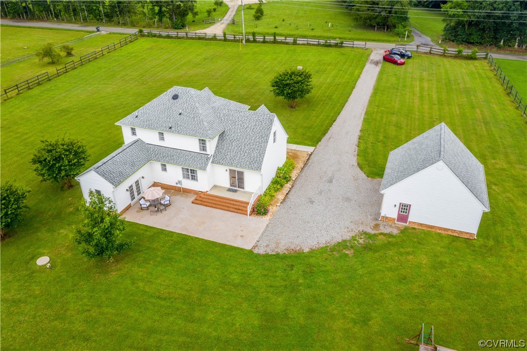 15803 Loving Union Road Disputanta, VA 23842 - Photo 11 of 39 an aerial view of a house with a garden and swimming pool