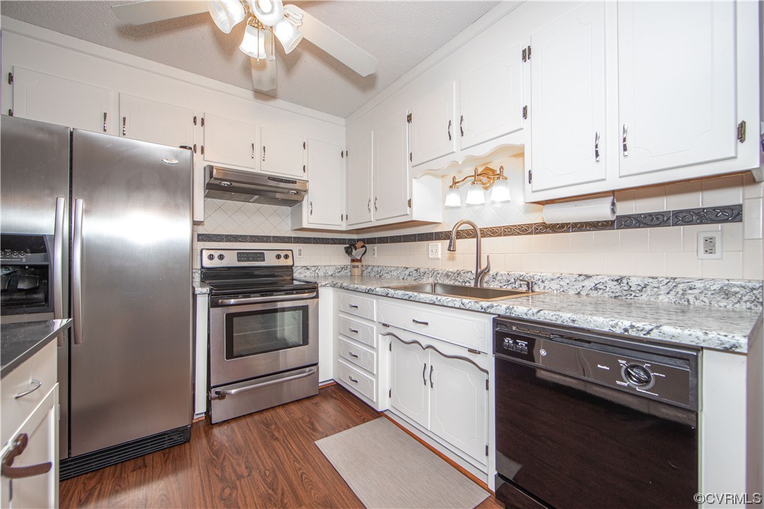 15803 Loving Union Road Disputanta, VA 23842 - Photo 14 of 39 a kitchen with granite countertop a sink stainless steel appliances and cabinets