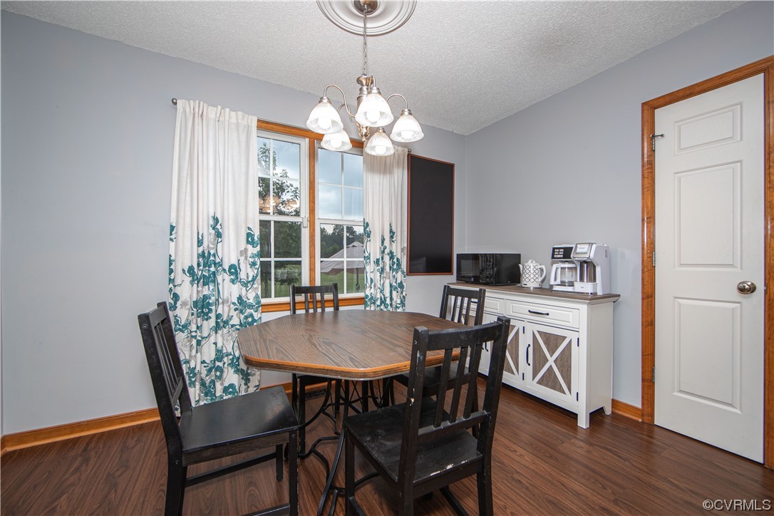 15803 Loving Union Road Disputanta, VA 23842 - Photo 15 of 39 a view of a dining room with furniture window and wooden floor