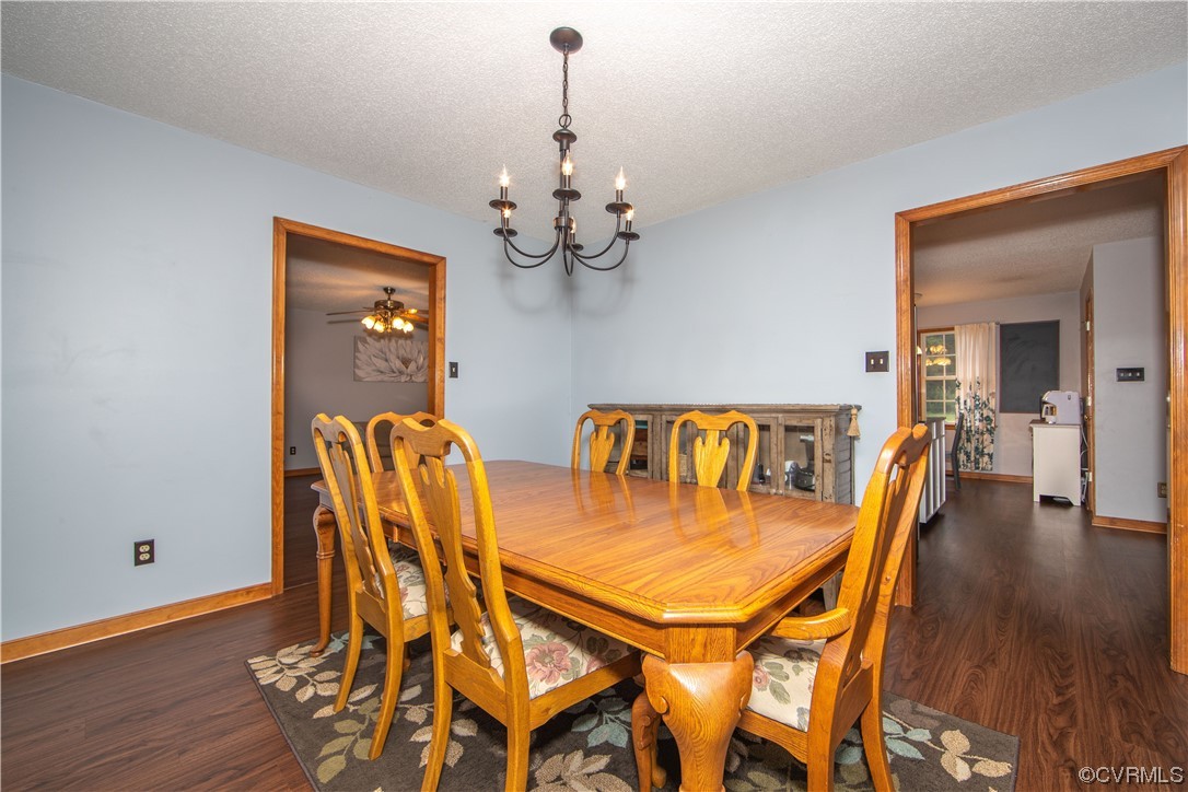 15803 Loving Union Road Disputanta, VA 23842 - Photo 21 of 39 a dining room with furniture and wooden floor