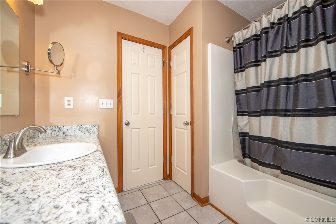 15803 Loving Union Road Disputanta, VA 23842 - Photo 26 of 39 a bathroom with a tub sink and shower