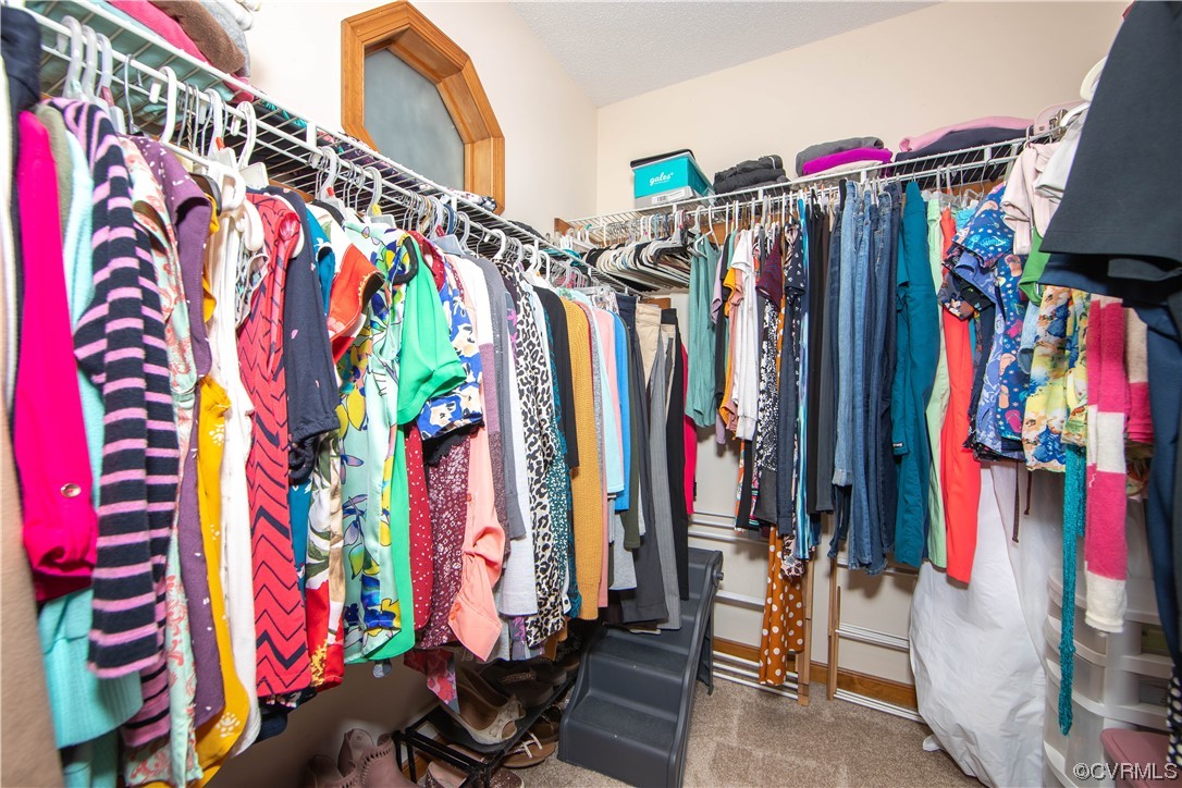 15803 Loving Union Road Disputanta, VA 23842 - Photo 27 of 39 a view of walk in closet with clothes
