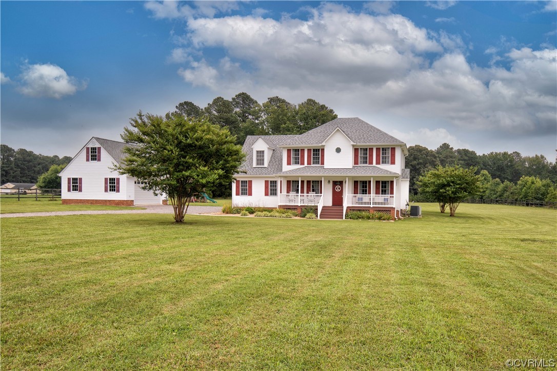 15803 Loving Union Road Disputanta, VA 23842 - Photo 3 of 39 a front view of a house with a garden