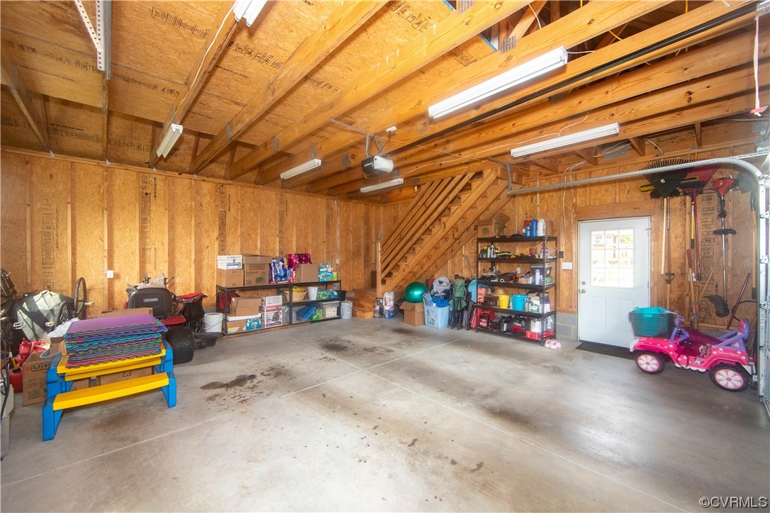 15803 Loving Union Road Disputanta, VA 23842 - Photo 37 of 39 a garage with furniture and a chandelier