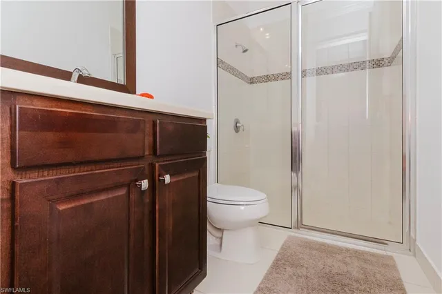 a bathroom with a shower and a toilet