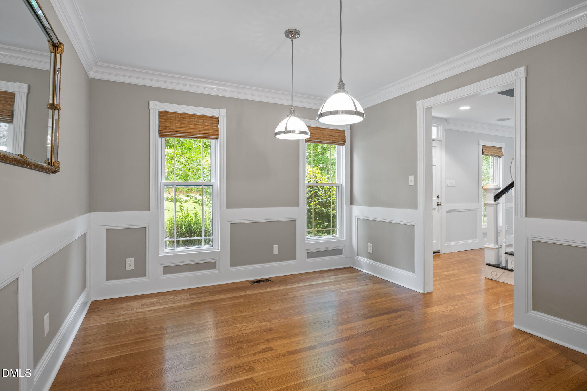 8221 Harps Mill Road Raleigh, NC 27615 - Photo 11 of 46 a view of an empty room with a window and wooden floor