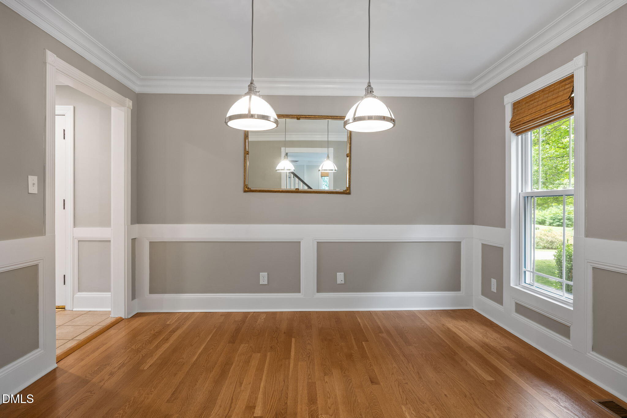 8221 Harps Mill Road Raleigh, NC 27615 - Photo 13 of 46 a view of room with window and hardwood floor