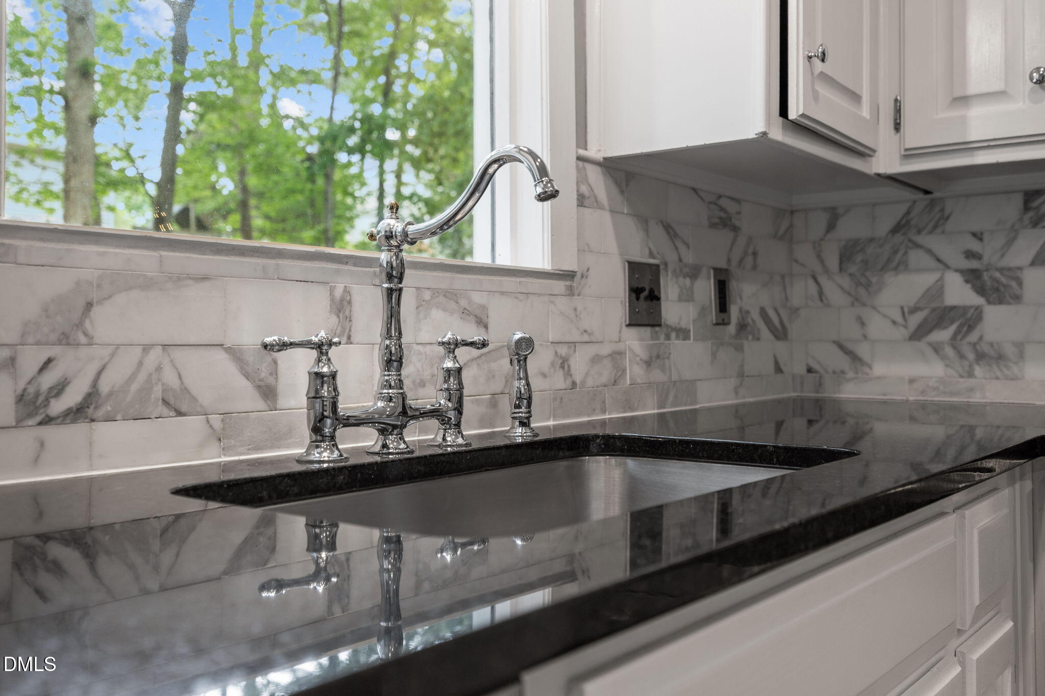8221 Harps Mill Road Raleigh, NC 27615 - Photo 18 of 46 a close view of sink and tap