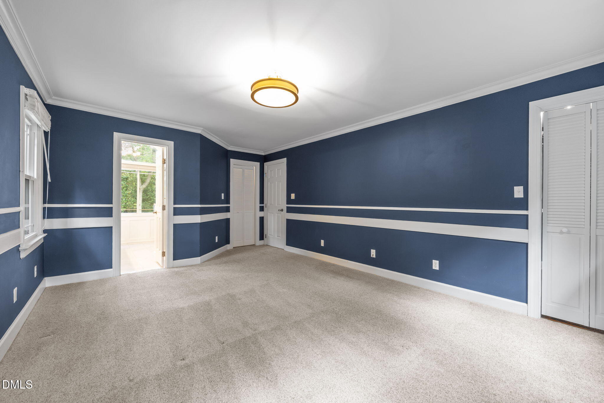 8221 Harps Mill Road Raleigh, NC 27615 - Photo 21 of 46 a view of an empty room with a window