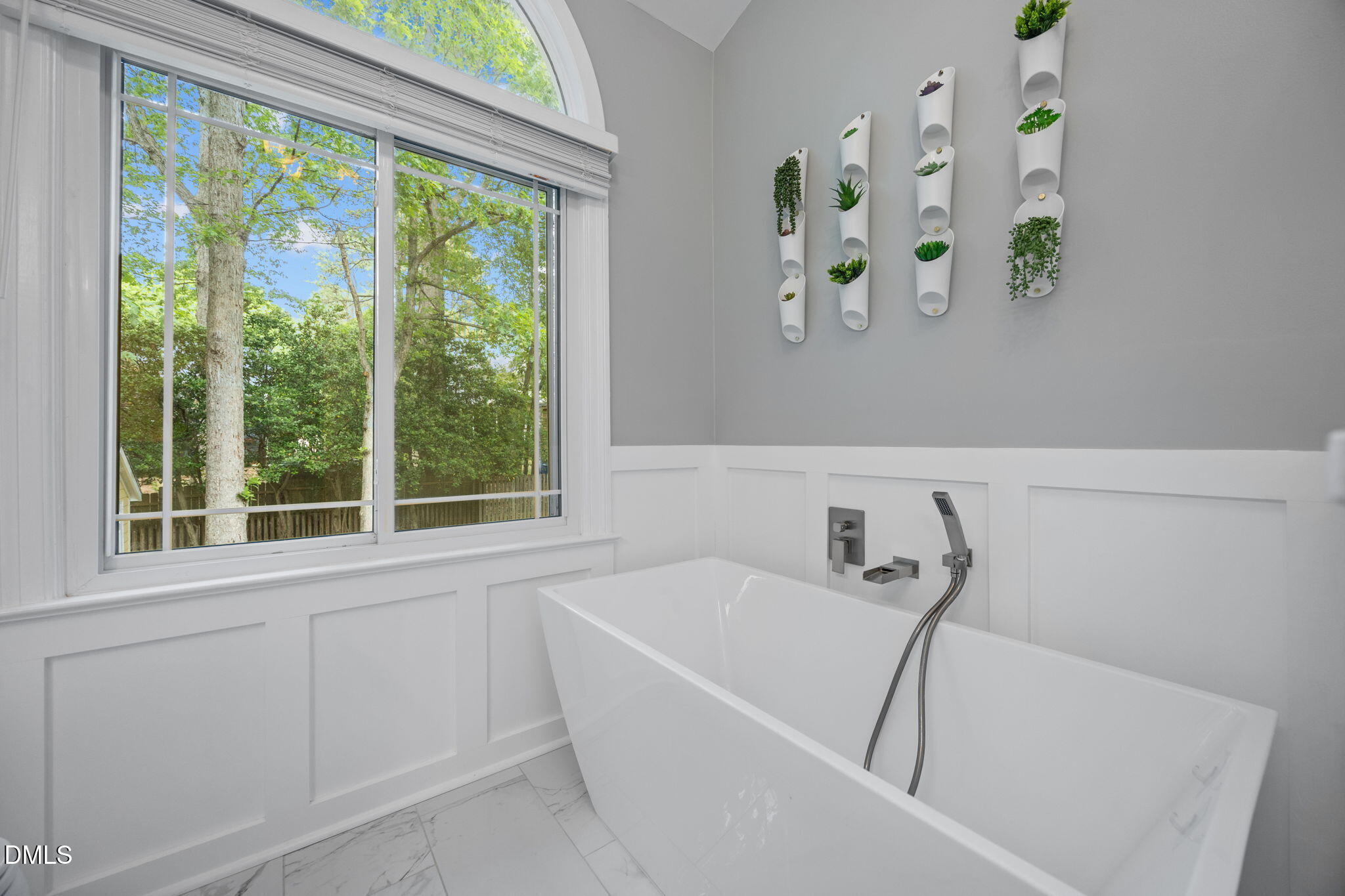 8221 Harps Mill Road Raleigh, NC 27615 - Photo 23 of 46 a white bath tub with a window