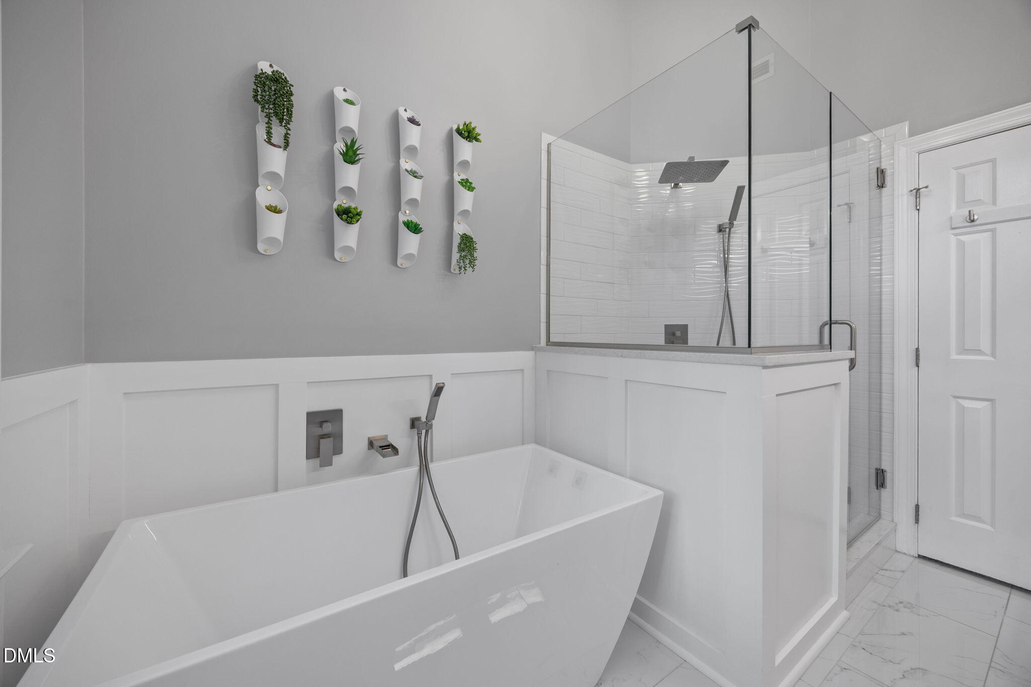 8221 Harps Mill Road Raleigh, NC 27615 - Photo 24 of 46 a bathroom with a bathtub and a shower