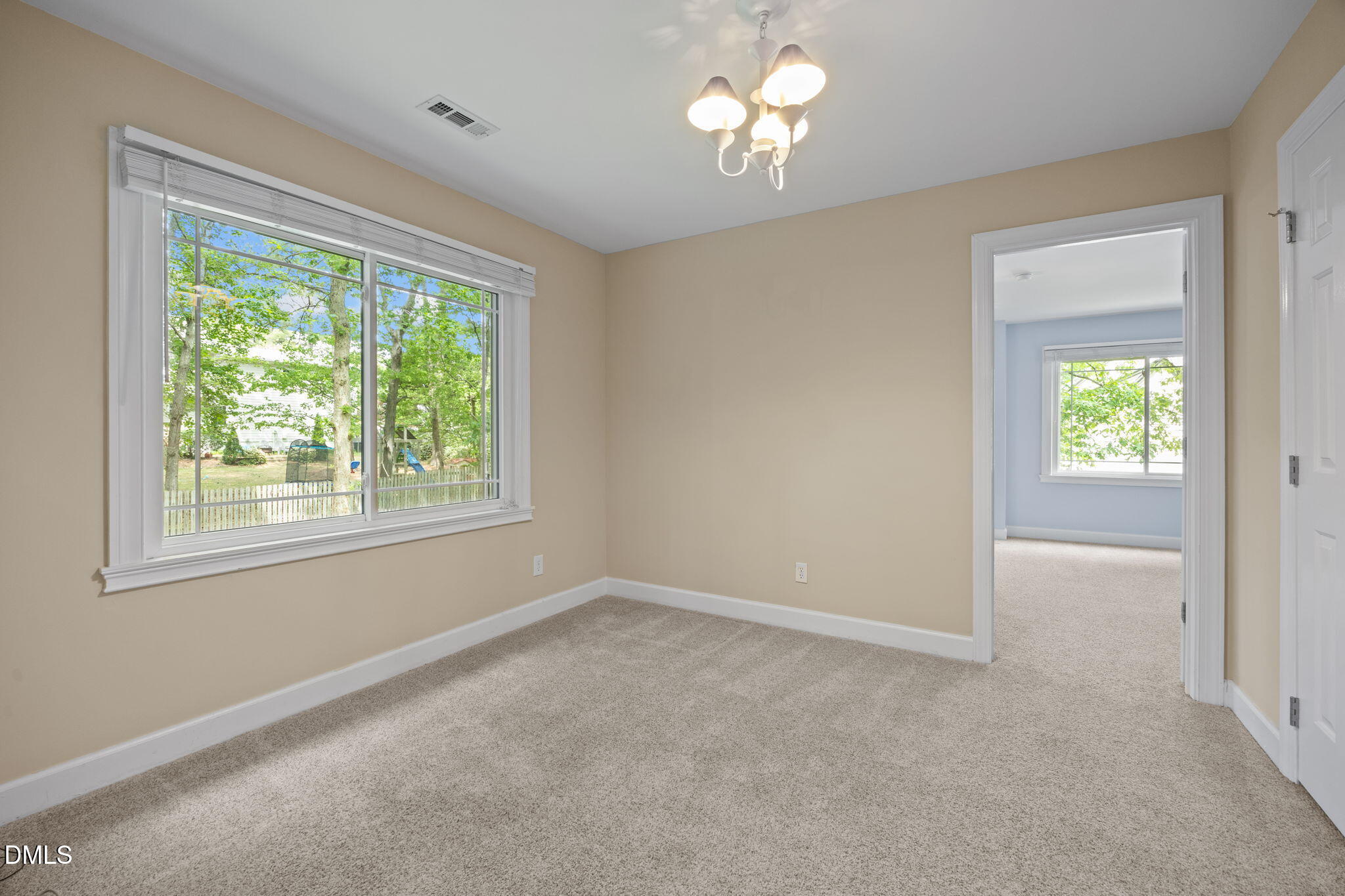 8221 Harps Mill Road Raleigh, NC 27615 - Photo 26 of 46 an empty room with a window