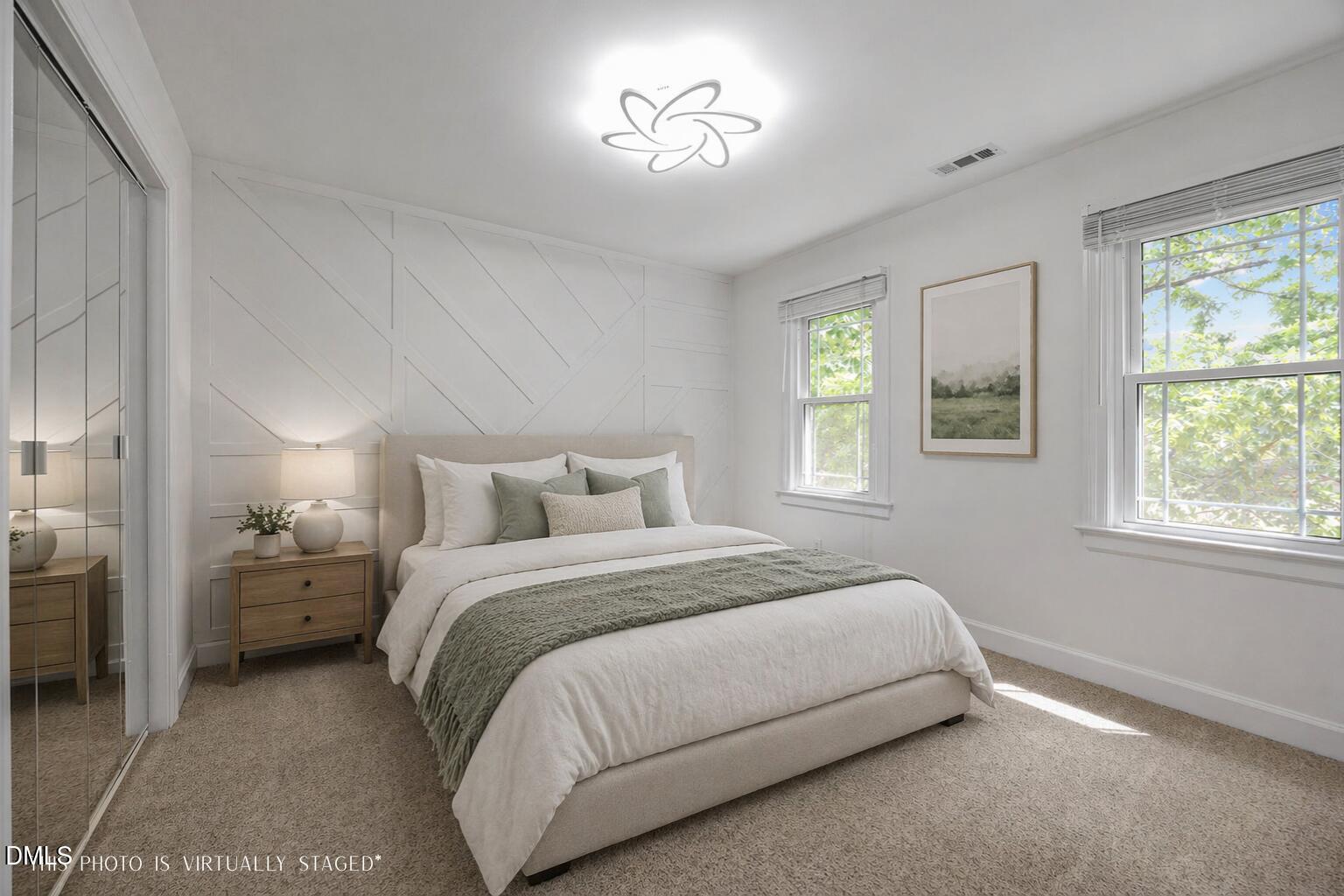 8221 Harps Mill Road Raleigh, NC 27615 - Photo 31 of 46 a spacious bedroom with a bed and a window